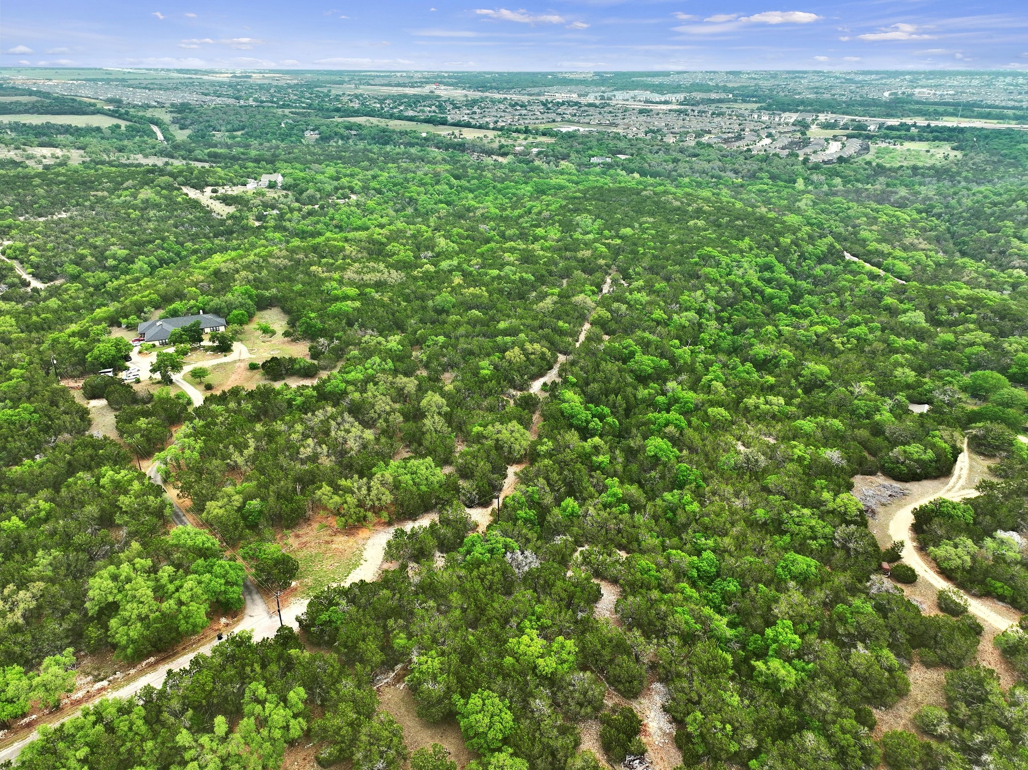 a view of a lush green space with sea