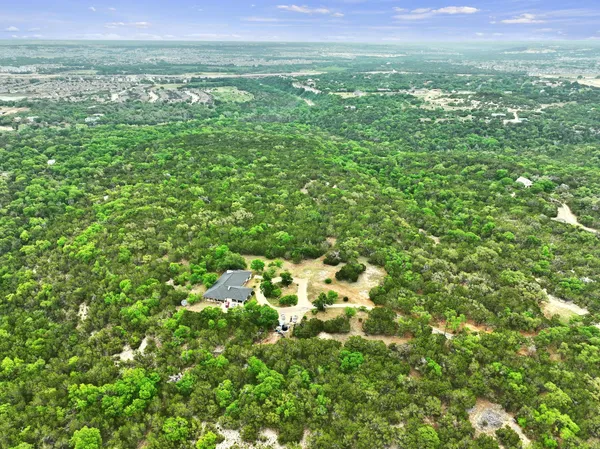 a view of a lush green space with sea
