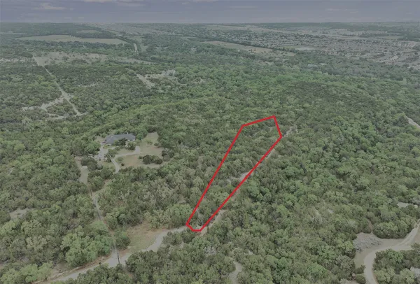 a view of a field with an outdoor space