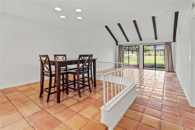 a view of a room with furniture and window