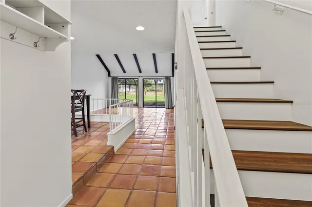 a view of a hallway view with staircase