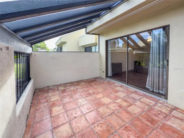 a large room with a large window and front door