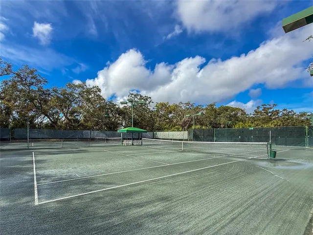 a view of an outdoor space and tennis court
