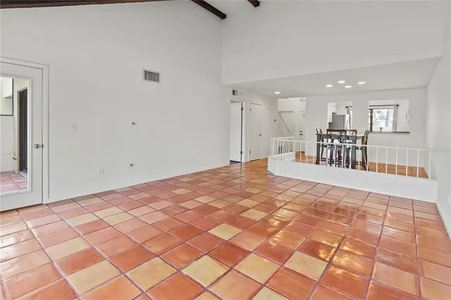 a large white bed in a white room