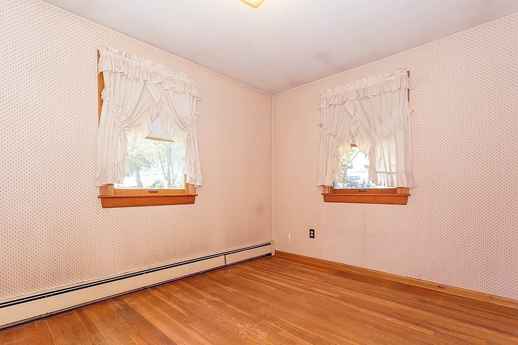 74 Summer Hill Road Maynard, MA 01754 - Photo 14 of 27 an empty room with wooden floor and windows