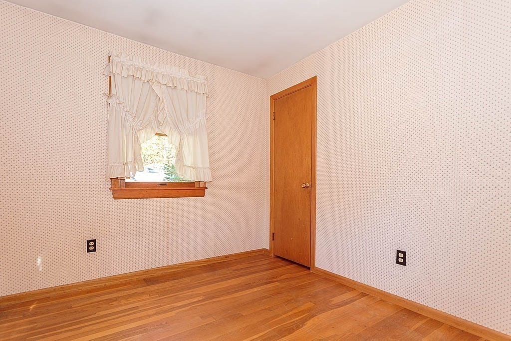 74 Summer Hill Road Maynard, MA 01754 - Photo 15 of 27 a view of an empty room with wooden floor and a window