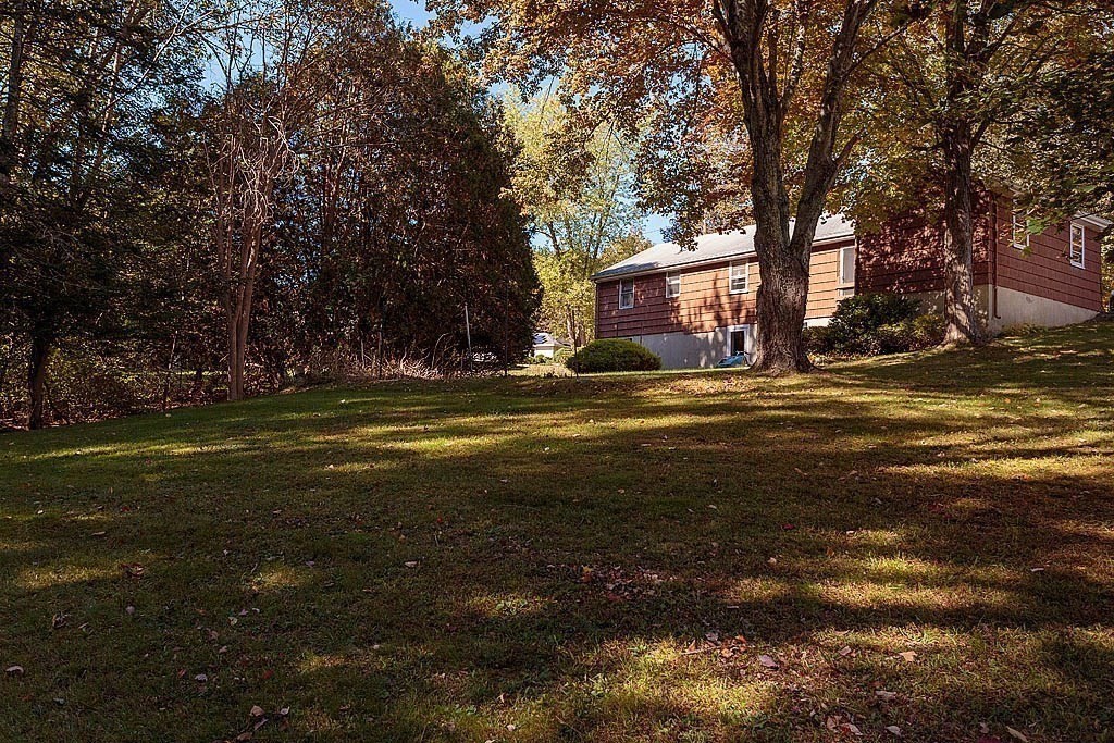 74 Summer Hill Road Maynard, MA 01754 - Photo 23 of 27 a view of a house with a big yard