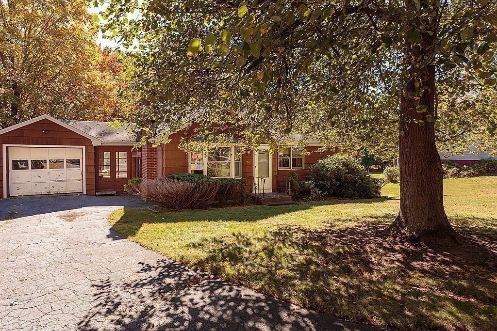 74 Summer Hill Road Maynard, MA 01754 - Photo 24 of 27 a front view of a house with a yard and fountain