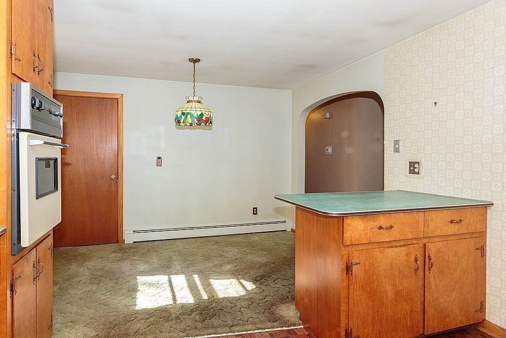74 Summer Hill Road Maynard, MA 01754 - Photo 6 of 27 a kitchen with stainless steel appliances granite countertop a stove a refrigerator and a wooden cabinets