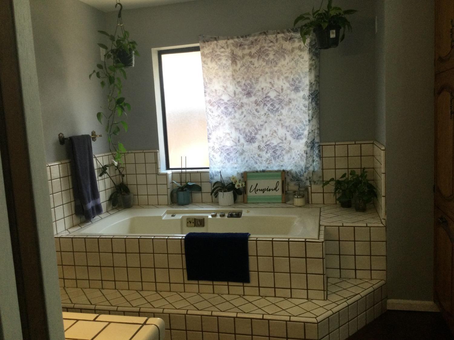 308 Monroe Street Coalinga, CA 93210 - Photo 15 of 35 a bathroom with a sink a mirror and shower