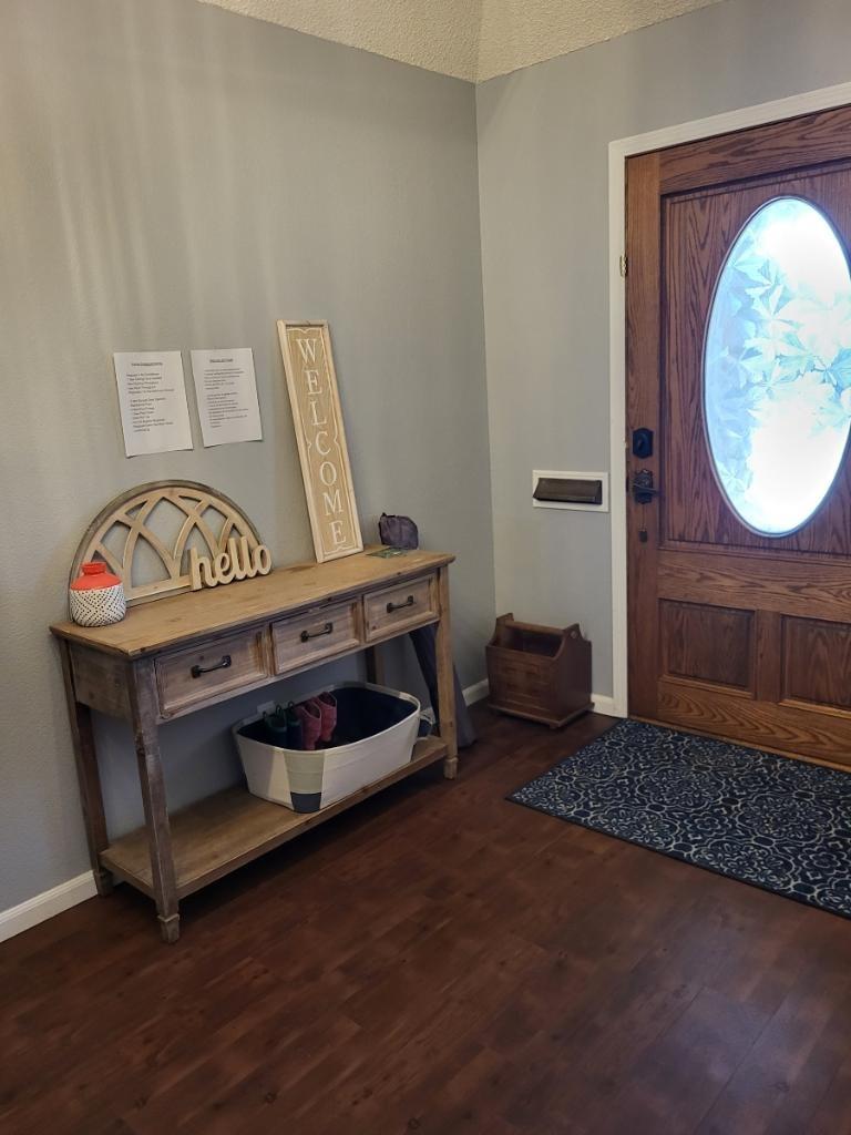 308 Monroe Street Coalinga, CA 93210 - Photo 2 of 35 a living room with furniture and a wooden floor