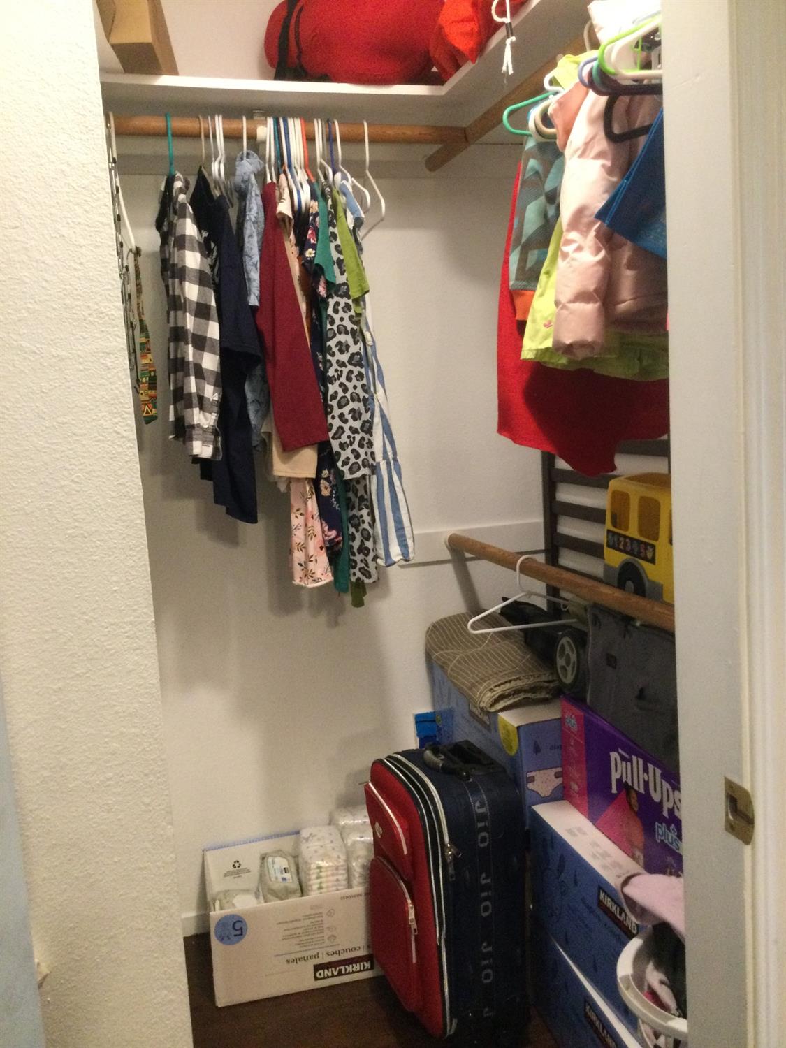 308 Monroe Street Coalinga, CA 93210 - Photo 21 of 35 a view of walk in closet with clothes and shoes