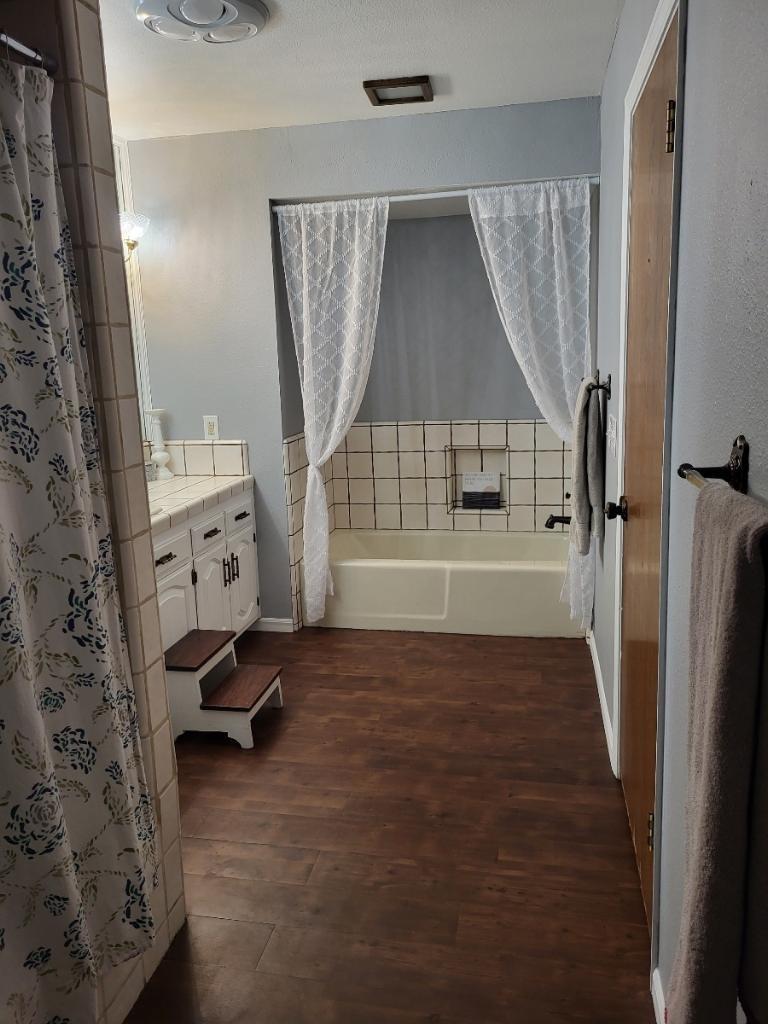 308 Monroe Street Coalinga, CA 93210 - Photo 22 of 35 workspace with wooden floor and windows