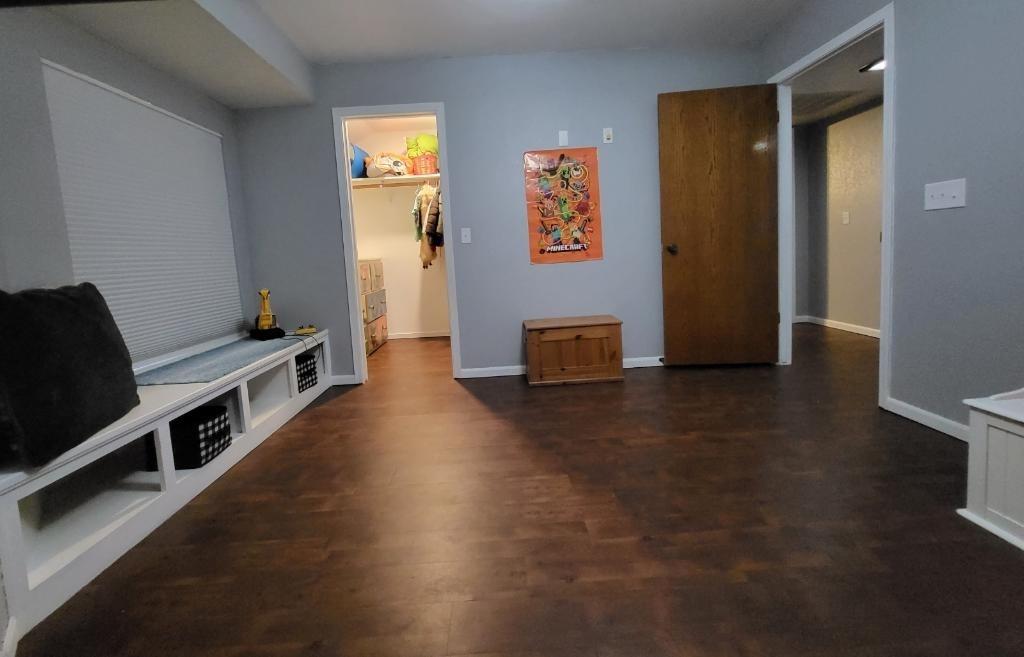 308 Monroe Street Coalinga, CA 93210 - Photo 24 of 35 a view of a hallway with workspace and wooden floor