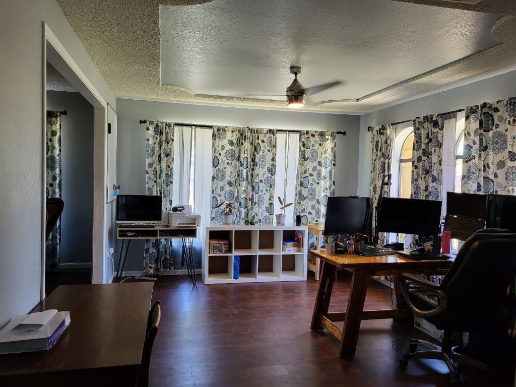 308 Monroe Street Coalinga, CA 93210 - Photo 3 of 35 a view of a workspace with furniture window and wooden floor