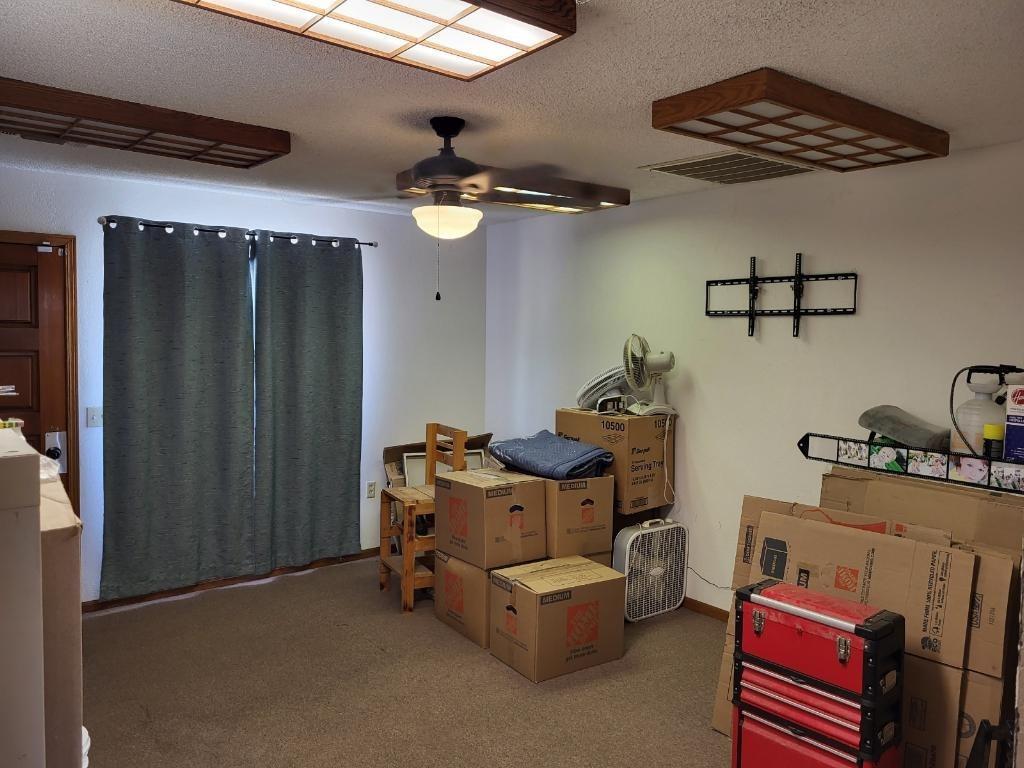 308 Monroe Street Coalinga, CA 93210 - Photo 33 of 35 a living room with furniture and a ceiling fan