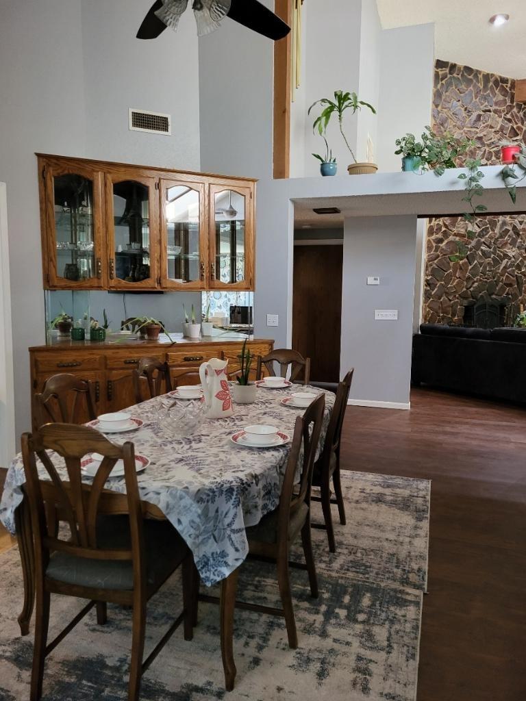 308 Monroe Street Coalinga, CA 93210 - Photo 4 of 35 a view of a dining room with furniture and wooden floor