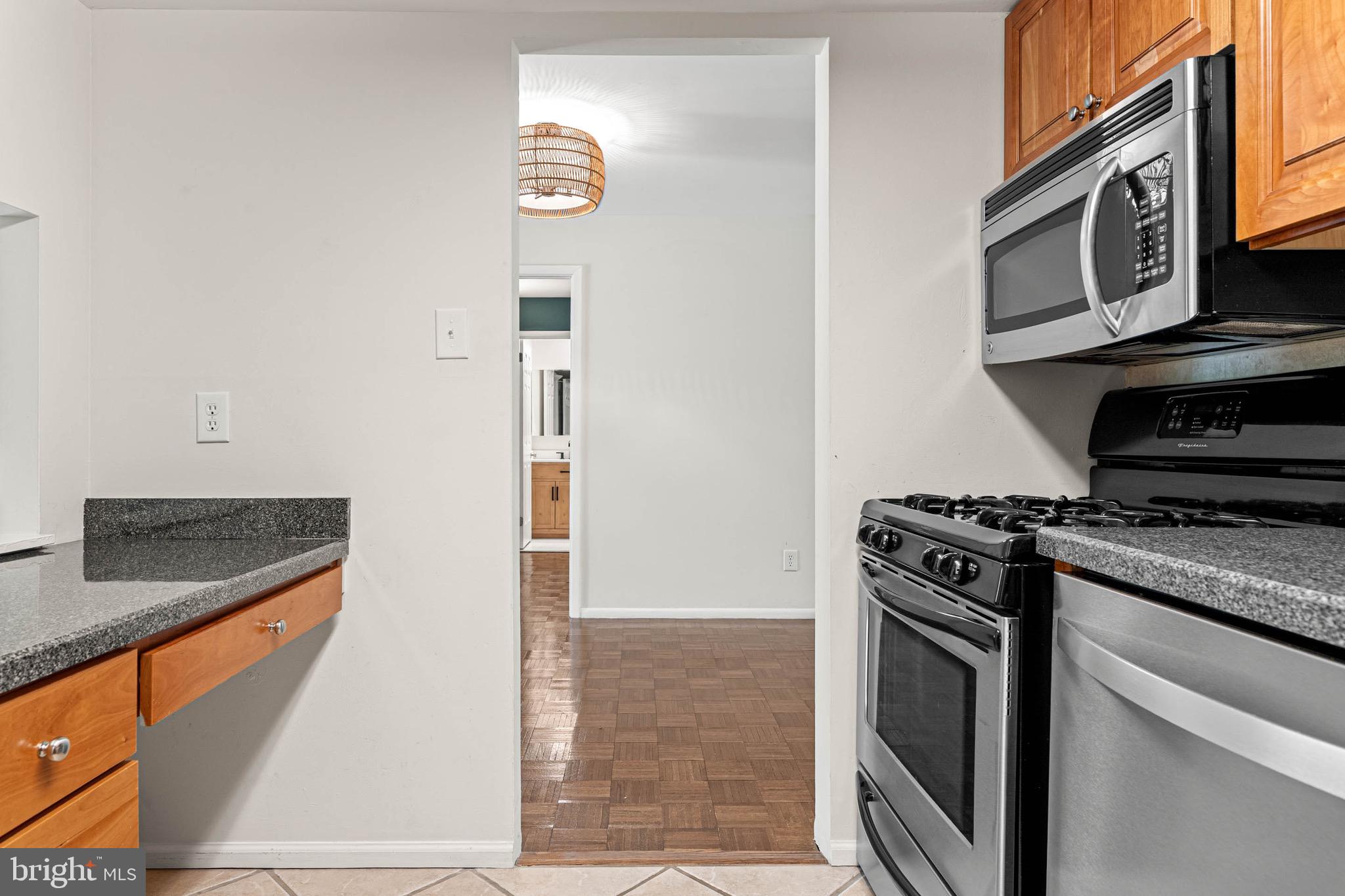 423 Old Forge Crossing, Unit 423 Devon, PA 19333 - Photo 12 of 24 Kitchen w/ desk/additional counter space