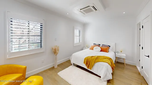 a bedroom with bed and window