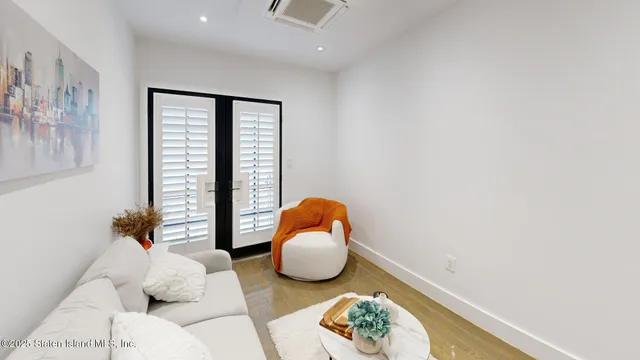 a bedroom with furniture and a window