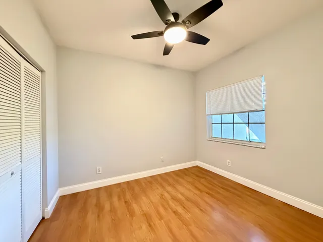 a bedroom with bed and flat screen tv