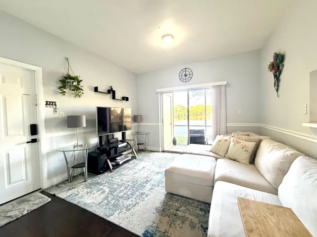 a view of a lake with houses in the background