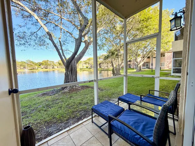 a view of a chairs in backyard of the house