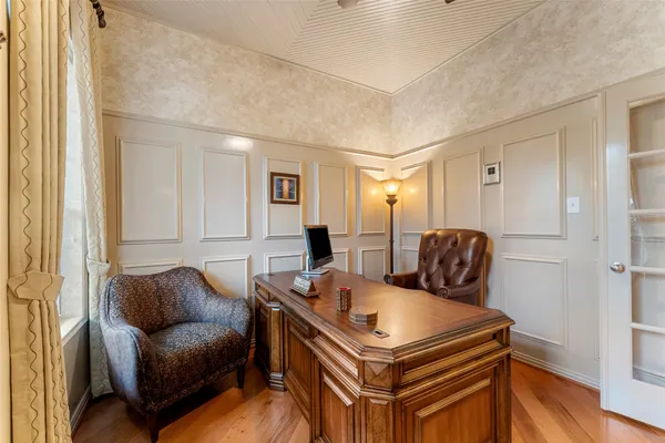 a living room with furniture a ceiling fan and a window
