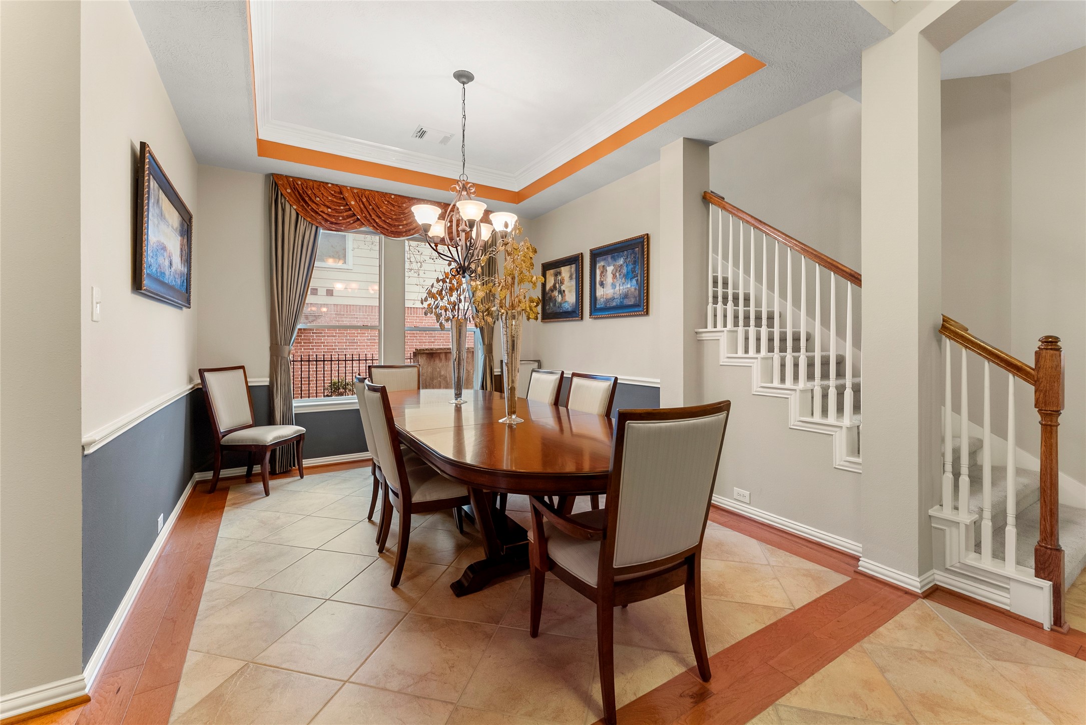 55 Granite Path Place Spring, TX 77389 - Photo 13 of 50 a dining room with furniture a chandelier and wooden floor