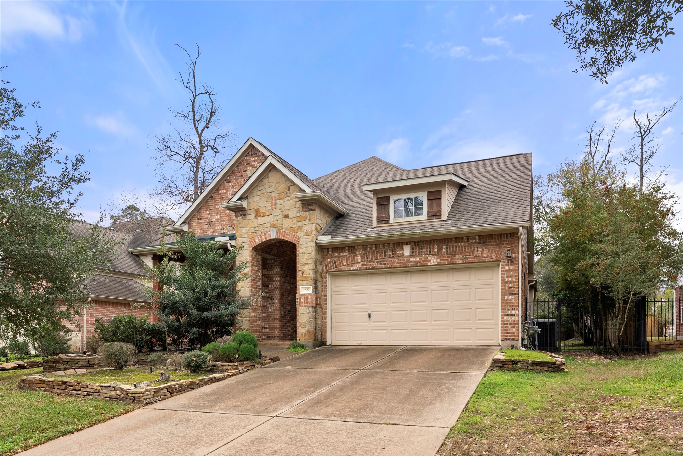 55 Granite Path Place Spring, TX 77389 - Photo 2 of 50 a front view of a house with a yard and garage