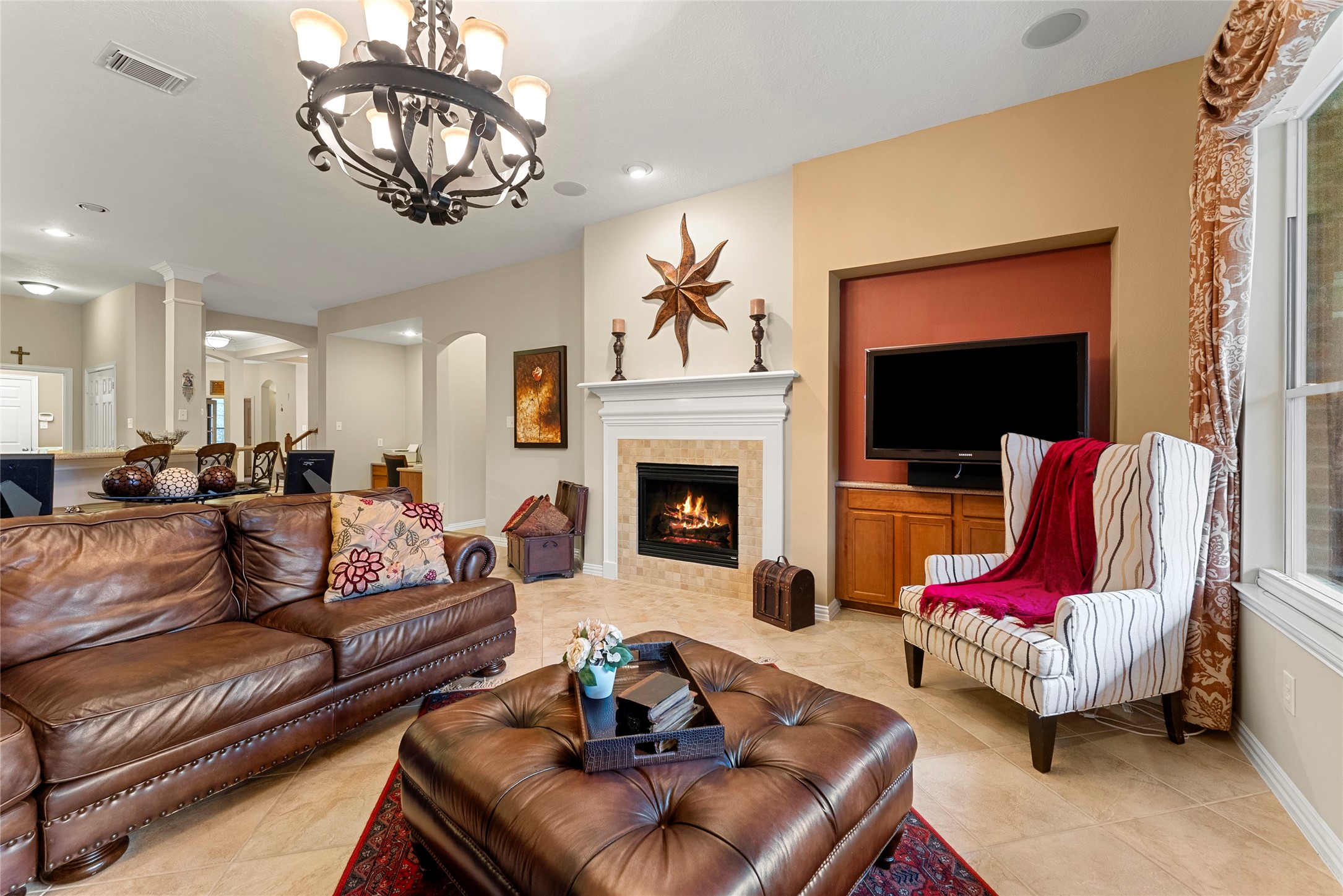 55 Granite Path Place Spring, TX 77389 - Photo 21 of 50 a living room with furniture or chandelier and a fireplace