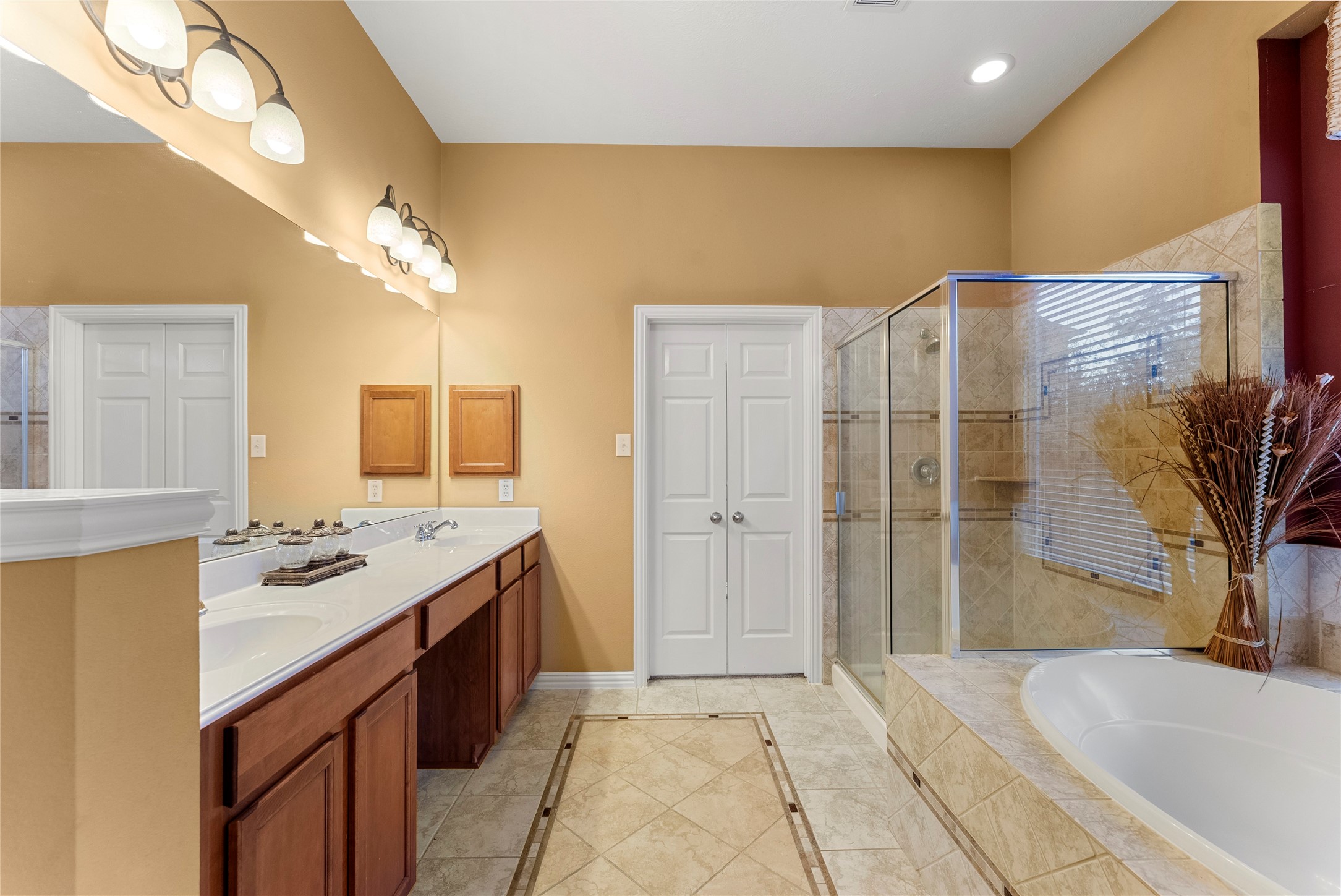 55 Granite Path Place Spring, TX 77389 - Photo 27 of 50 a spacious bathroom with a granite countertop sink a mirror a bathtub and shower
