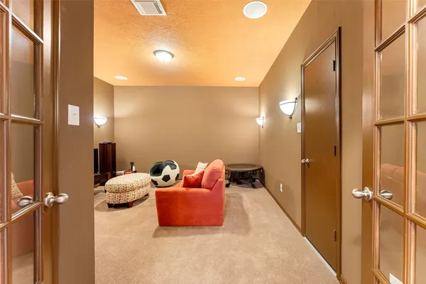 a bedroom with bed and a mirror