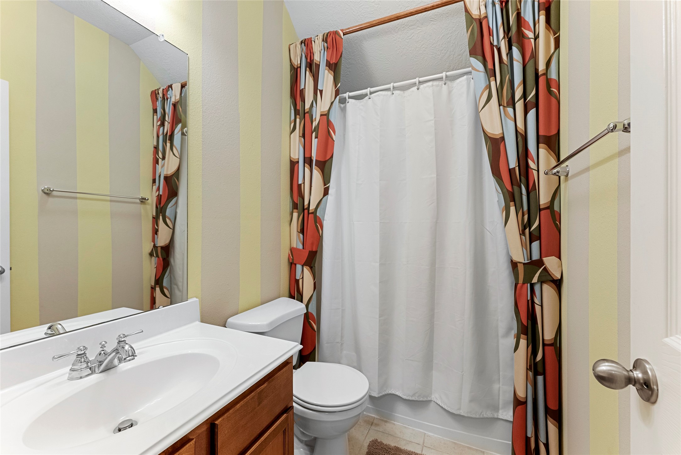 55 Granite Path Place Spring, TX 77389 - Photo 36 of 50 a bathroom with a sink a toilet and a shower curtain