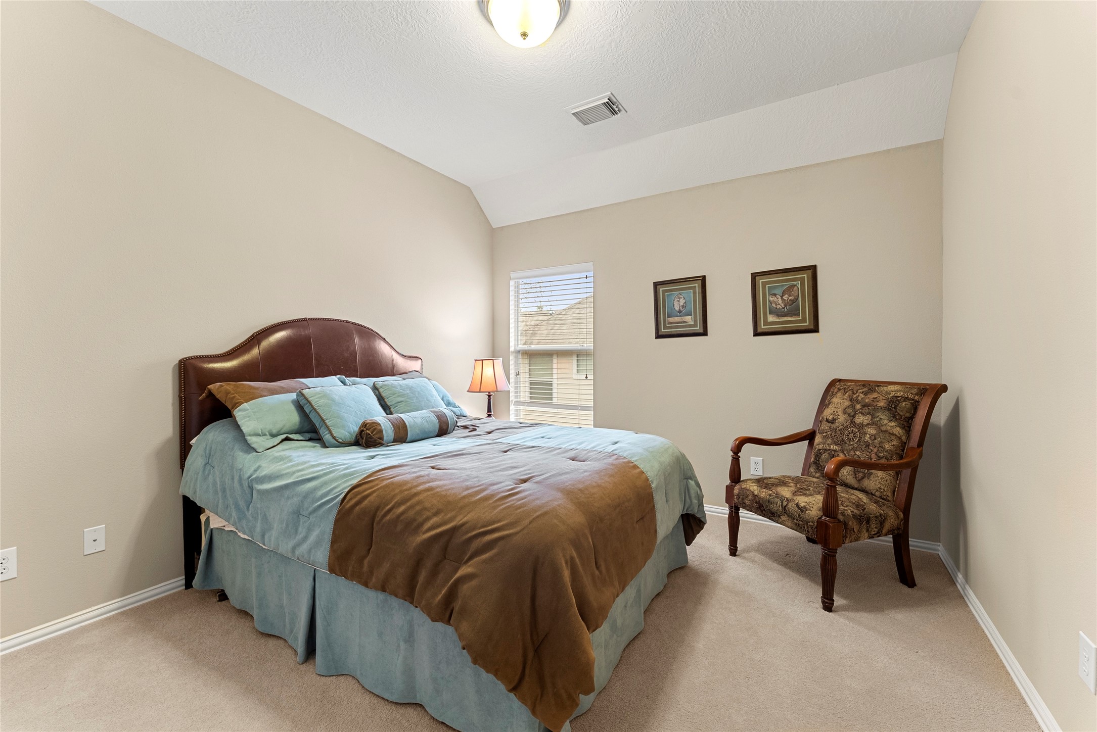 55 Granite Path Place Spring, TX 77389 - Photo 39 of 50 a bedroom with a bed and a chair