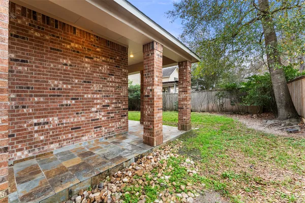 a view of house with backyard porch and garden