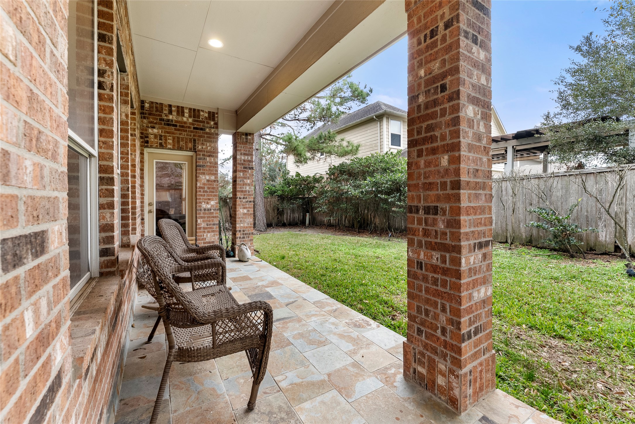 55 Granite Path Place Spring, TX 77389 - Photo 49 of 50 a view of a patio with a table chairs and a yard