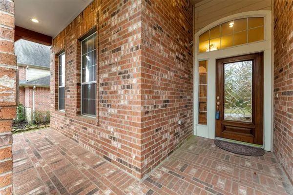 a view of a brick building next to a yard