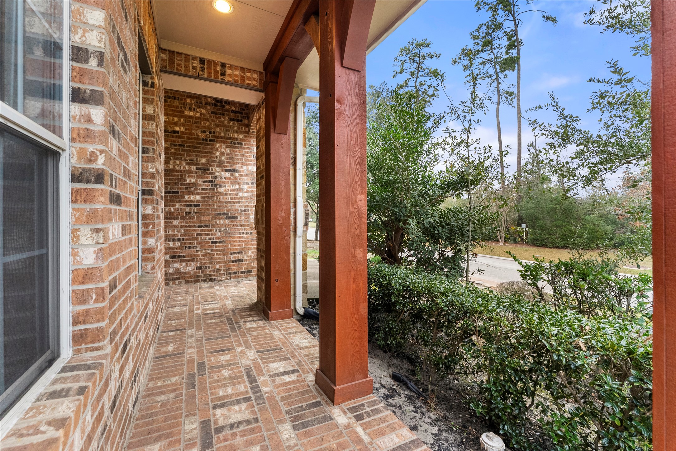 55 Granite Path Place Spring, TX 77389 - Photo 6 of 50 a view of a brick house with a yard