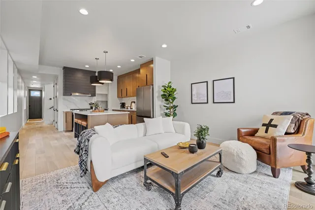 a living room with furniture and a table
