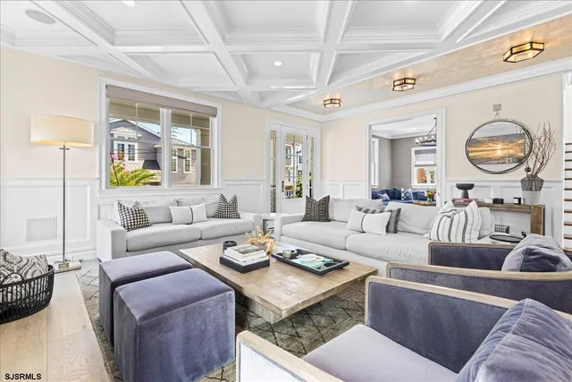 a kitchen with stainless steel appliances a sink a window and cabinets