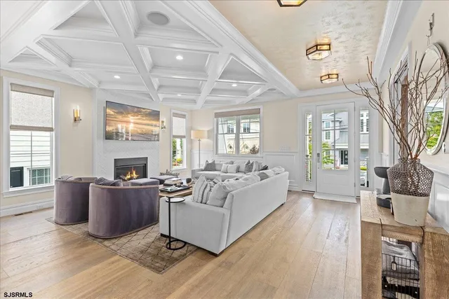 a view of a patio with couches table and chairs and potted plants