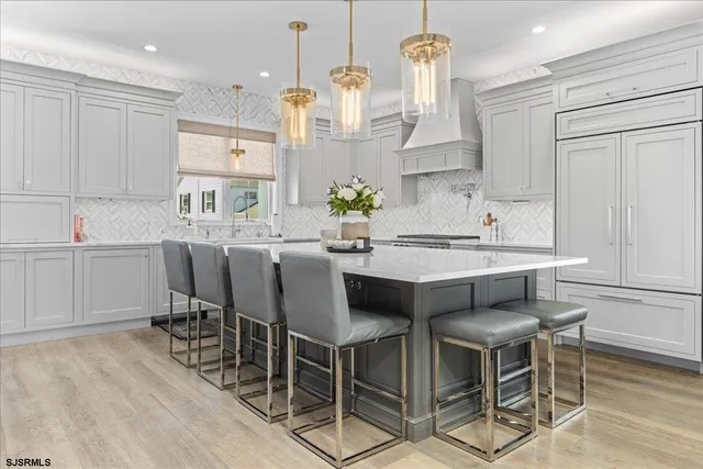 a view of a patio with couches and potted plants