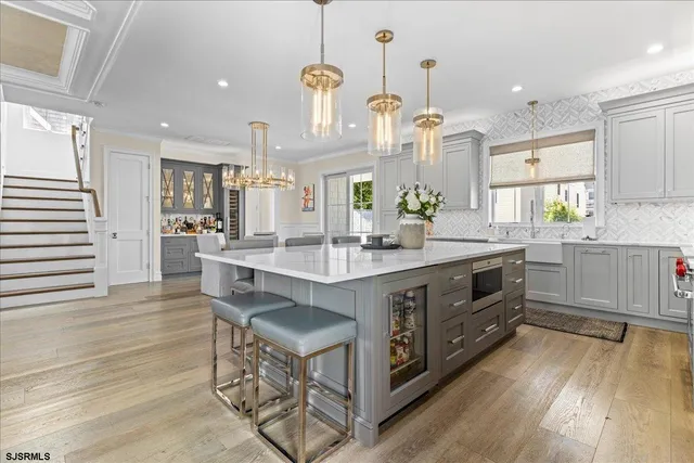 a view of a patio with couches table and chairs and potted plants