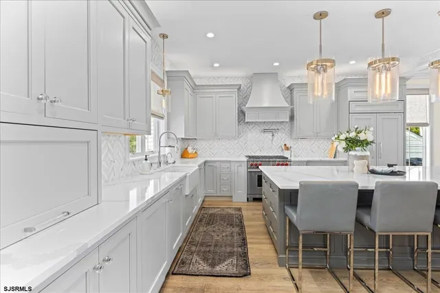 a living room with furniture and a dresser