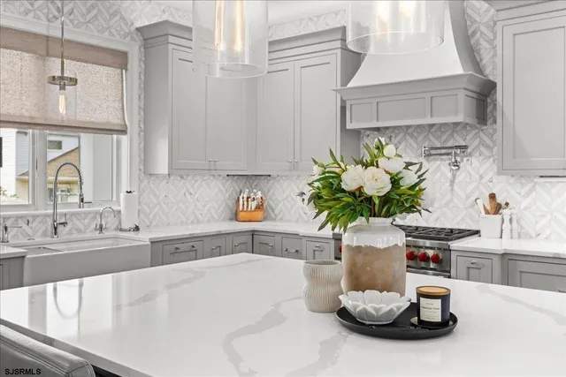 a white bath tub sitting in a bathroom next to a window