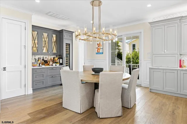 a view of a balcony with couches wooden floor and a floor to ceiling window