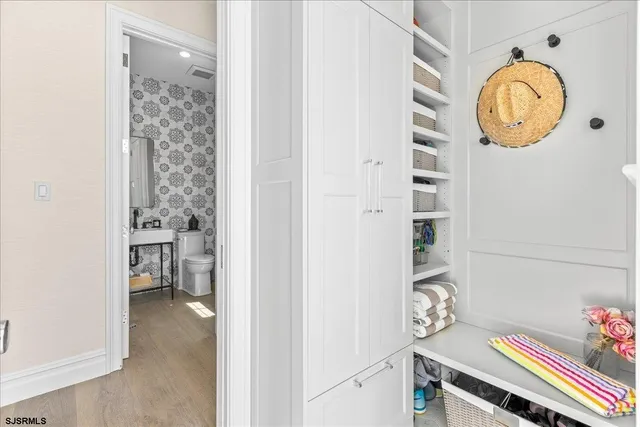 a view of storage and utility room with racks on the wall