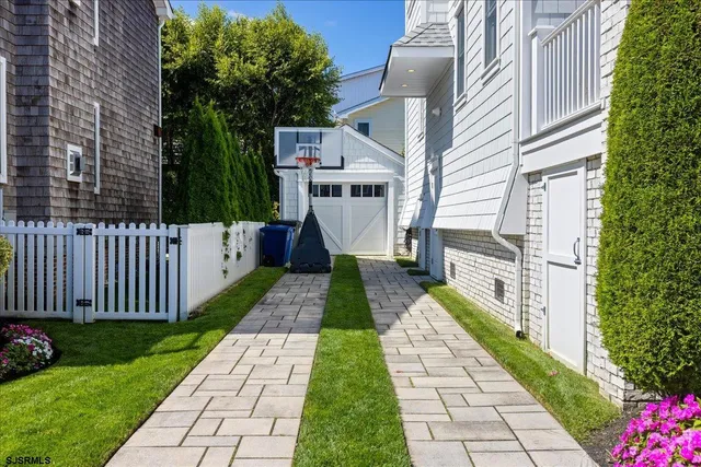 a living room with furniture kitchen view and a fireplace