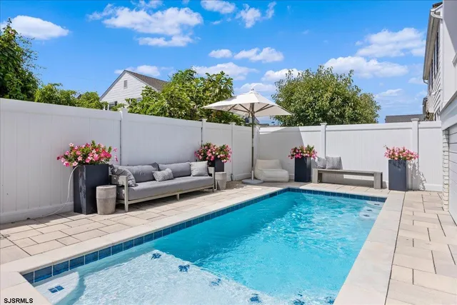 a bathroom with a sink a mirror and a shower